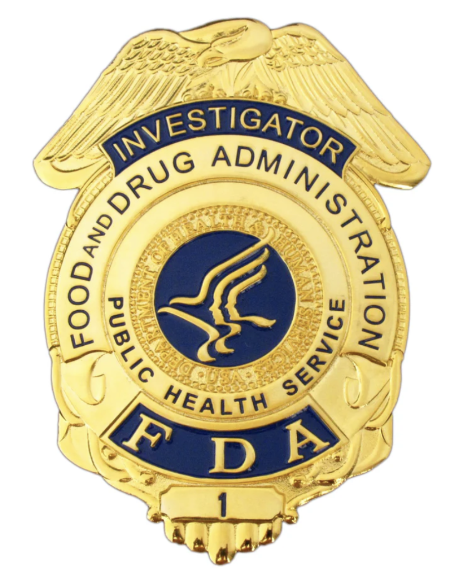 FDA investigator badge representing regulatory inspection authority
